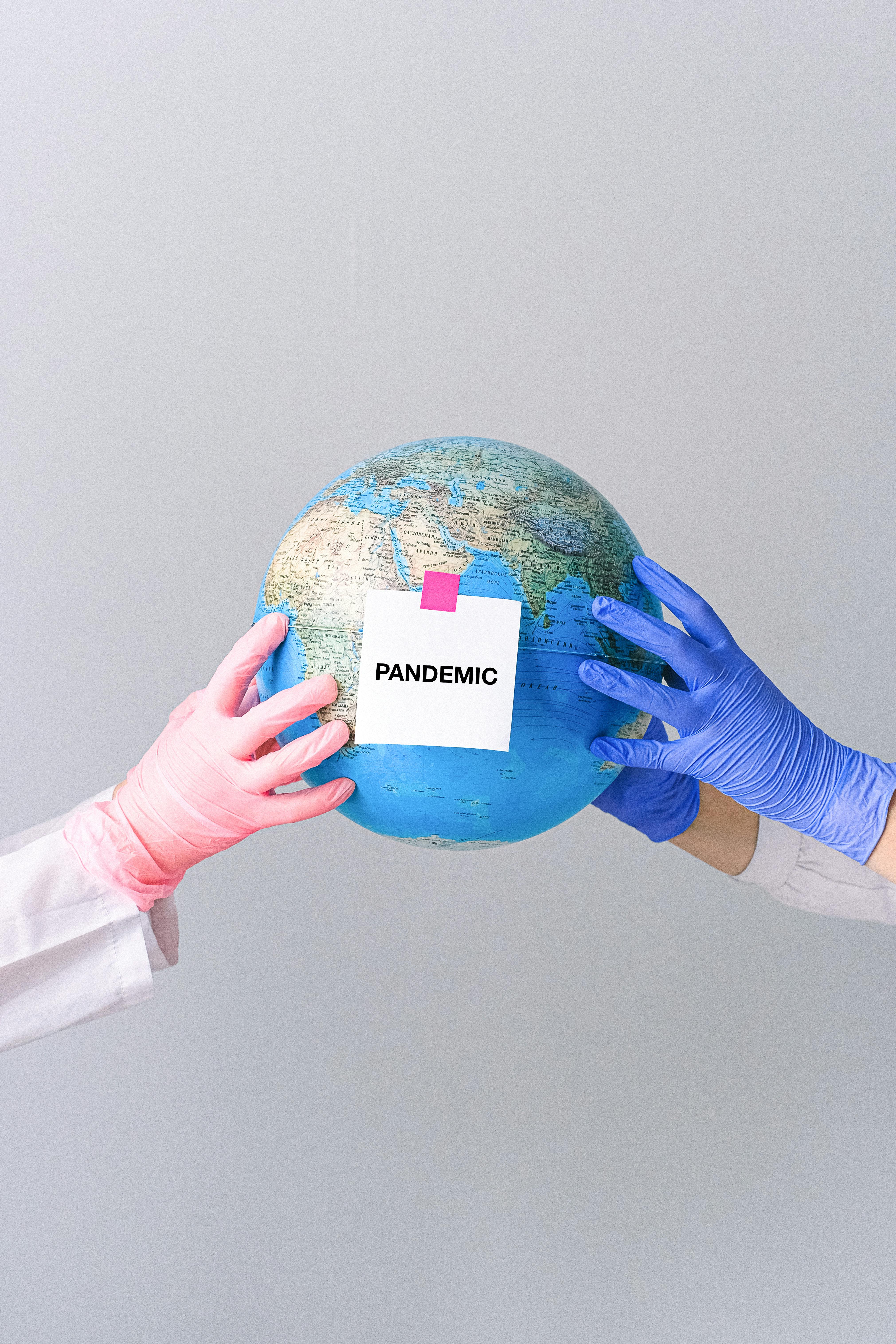 Hands holding a globe for epidemiology and public health